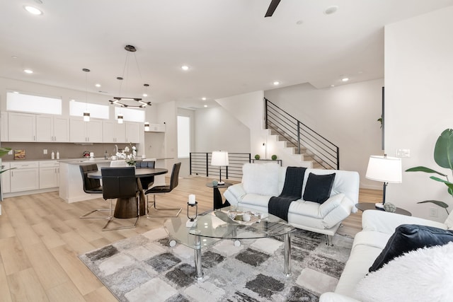 living room with plenty of natural light and light wood-type flooring