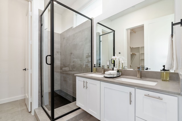 bathroom featuring vanity and a shower with shower door