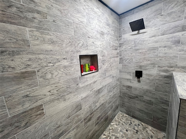 bathroom with a tile shower