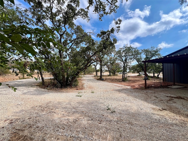 view of yard with a rural view