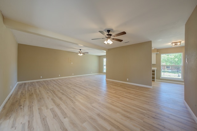 empty room featuring ceiling fan and light wood-type flooring