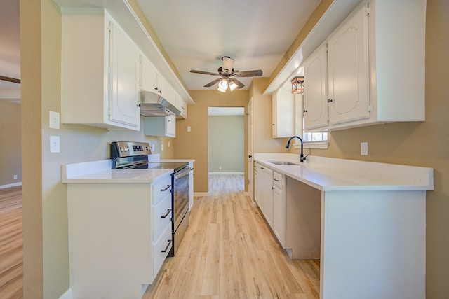 kitchen with stainless steel electric stove, light hardwood / wood-style flooring, sink, ceiling fan, and white cabinets