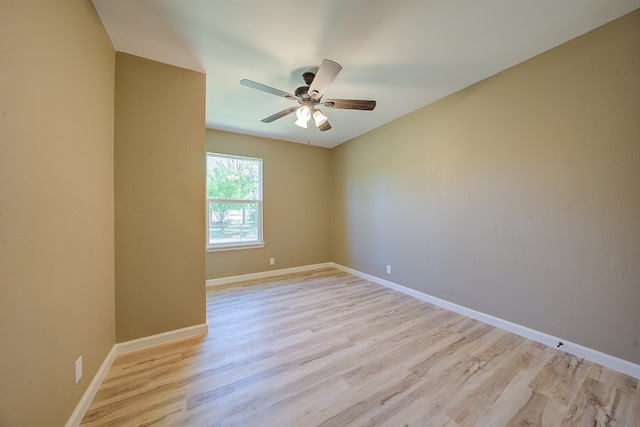 empty room featuring light wood-type flooring and ceiling fan