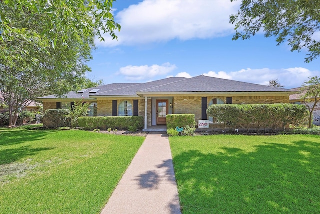 ranch-style home featuring a front yard