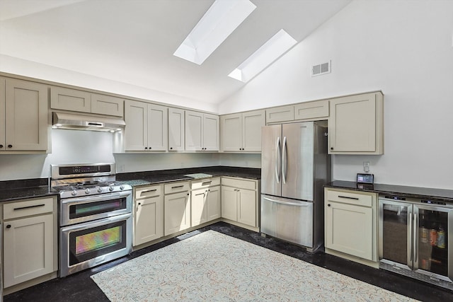 kitchen with wine cooler, stainless steel appliances, gray cabinets, high vaulted ceiling, and a skylight