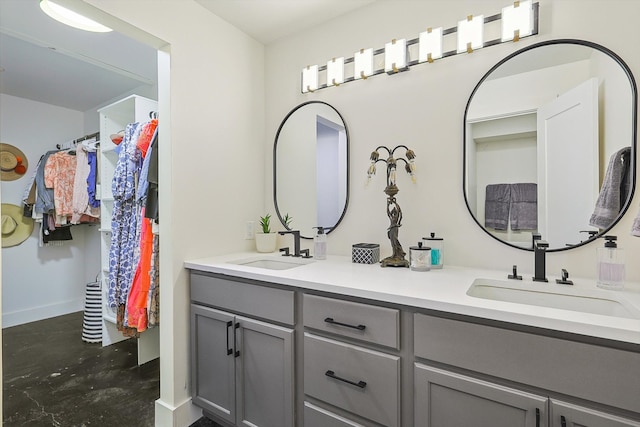 bathroom with vanity and concrete floors