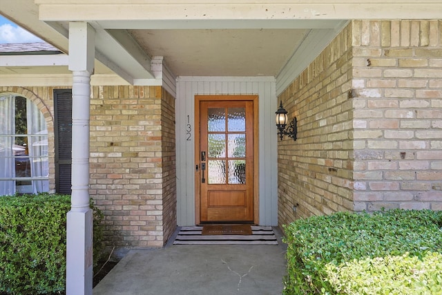 doorway to property with covered porch