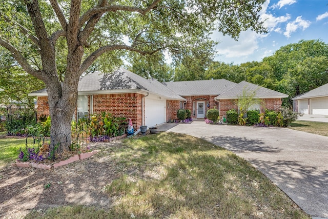 ranch-style house featuring a garage and a front yard