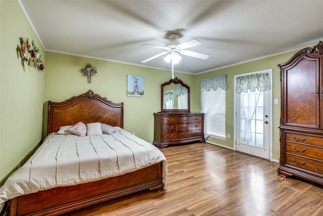 bedroom with light wood-type flooring, ornamental molding, access to exterior, and ceiling fan