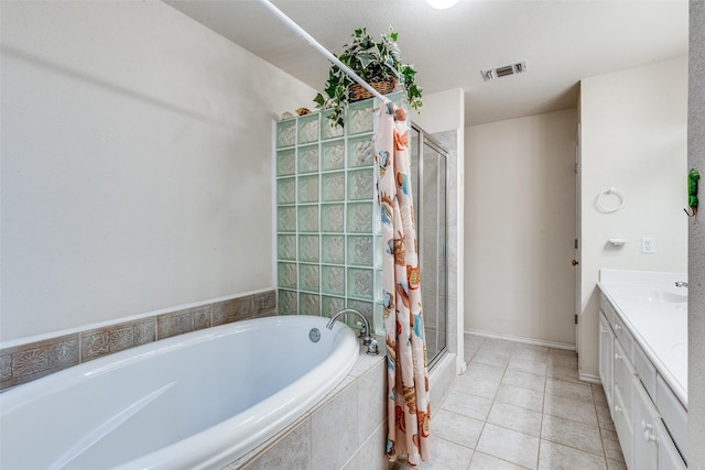 bathroom featuring tile patterned floors, visible vents, a stall shower, a bath, and vanity