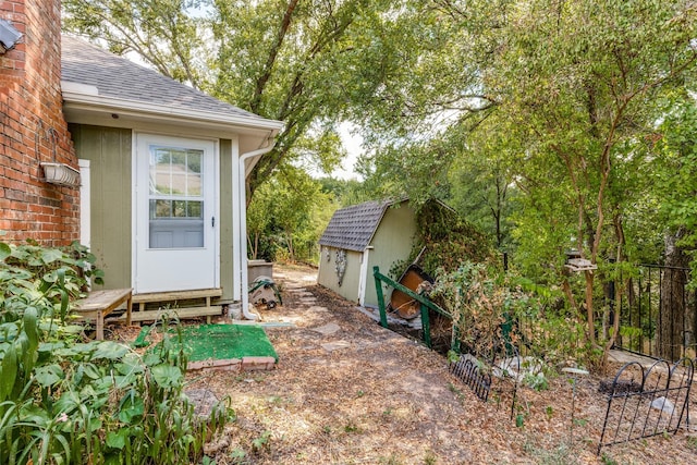 exterior space with an outdoor structure and a shed