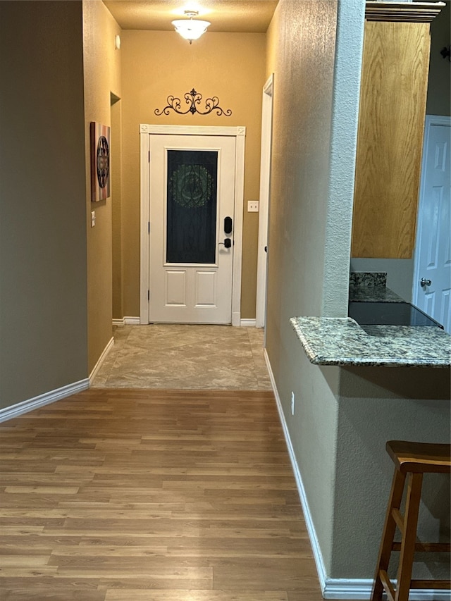 doorway featuring hardwood / wood-style floors