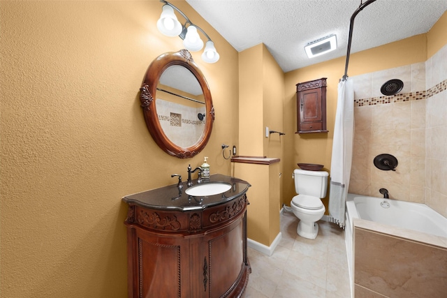 bathroom featuring a textured ceiling, toilet, visible vents, vanity, and baseboards