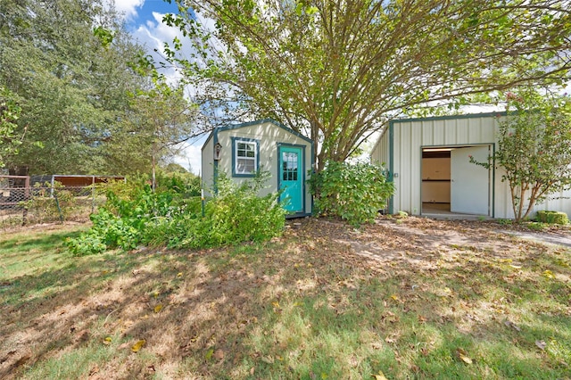 view of shed with fence