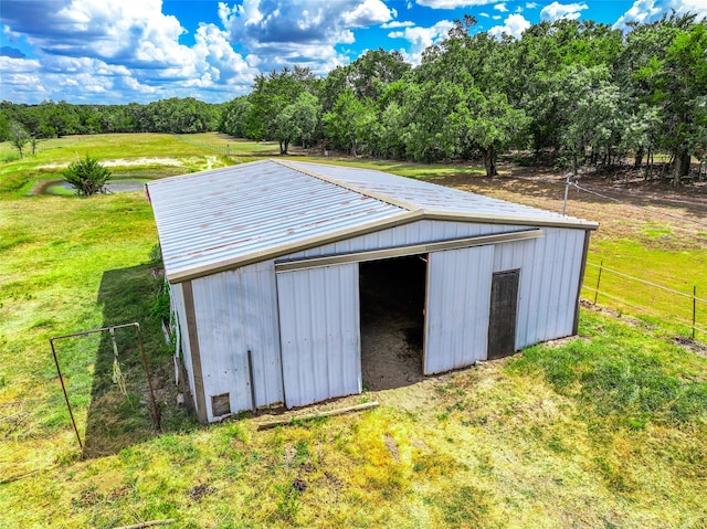 view of outbuilding with a yard