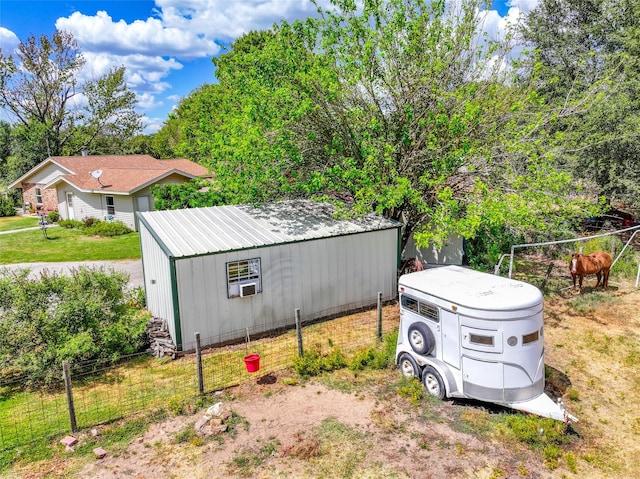 exterior space with fence and a lawn