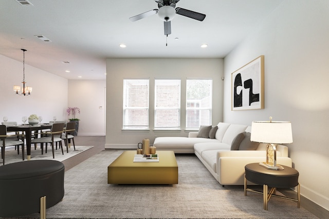 carpeted living room featuring ceiling fan