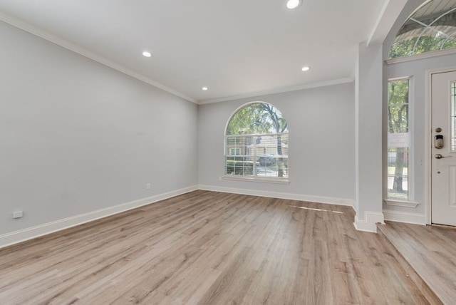 interior space featuring light wood-type flooring and ornamental molding