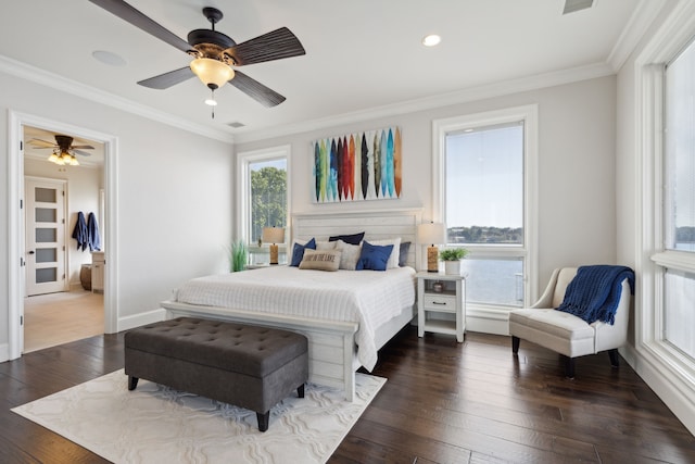 bedroom with ceiling fan, visible vents, baseboards, ornamental molding, and dark wood finished floors