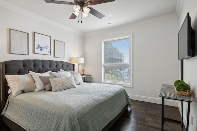 bedroom with dark wood-style floors, ceiling fan, ornamental molding, and baseboards