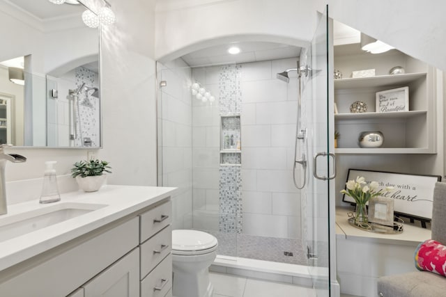 bathroom featuring tile patterned flooring, toilet, an enclosed shower, ornamental molding, and vanity