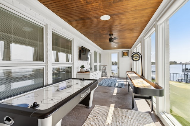 recreation room featuring wood ceiling and ceiling fan