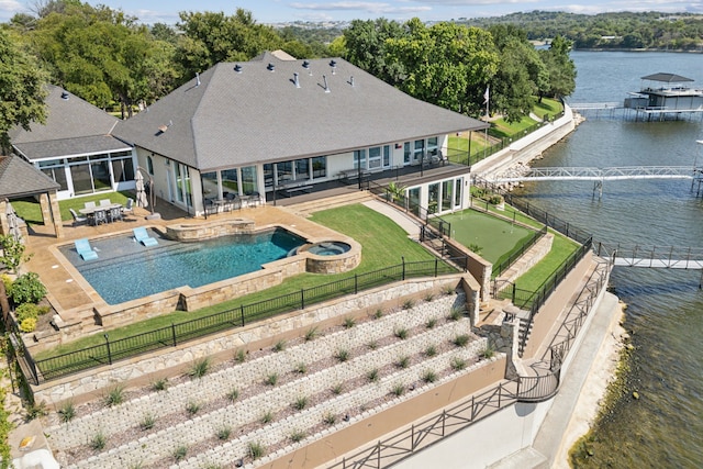 view of pool with a water view and a patio