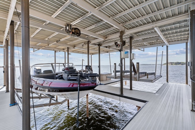 view of dock with a water view and boat lift