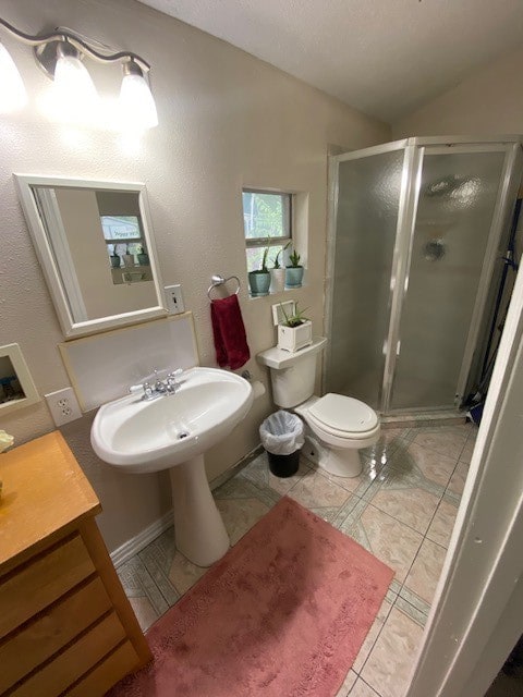 bathroom featuring toilet, an enclosed shower, tile patterned flooring, vanity, and vaulted ceiling