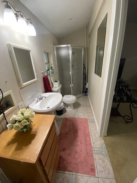 bathroom featuring walk in shower, toilet, and tile patterned flooring