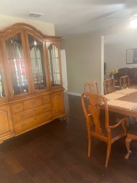 dining space featuring dark hardwood / wood-style flooring