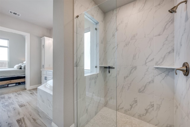 full bath with visible vents, ensuite bath, and a marble finish shower