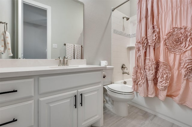 full bathroom with vanity, toilet, and shower / bath combo with shower curtain