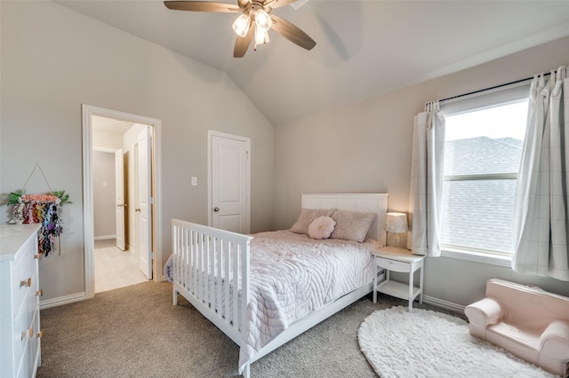 bedroom featuring vaulted ceiling, light carpet, a ceiling fan, and baseboards