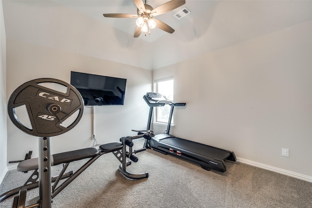 exercise area featuring carpet, visible vents, ceiling fan, and baseboards