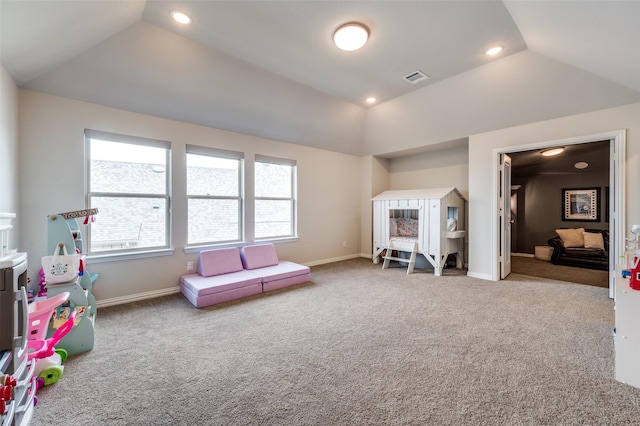 playroom with vaulted ceiling, carpet flooring, visible vents, and baseboards