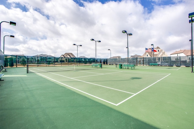 view of sport court with fence