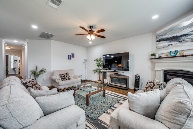 living room with ceiling fan and hardwood / wood-style flooring