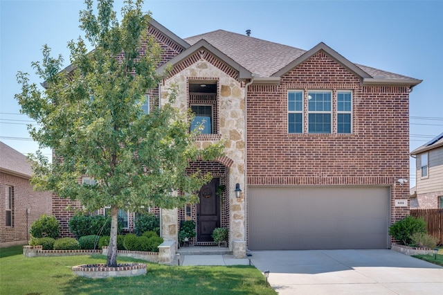 traditional-style home featuring brick siding, a shingled roof, concrete driveway, an attached garage, and stone siding