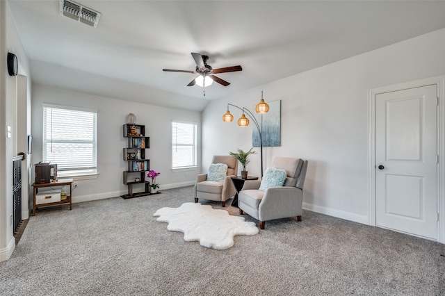 sitting room featuring ceiling fan and carpet floors