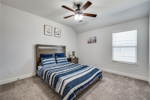 carpeted bedroom with vaulted ceiling, ceiling fan, and baseboards