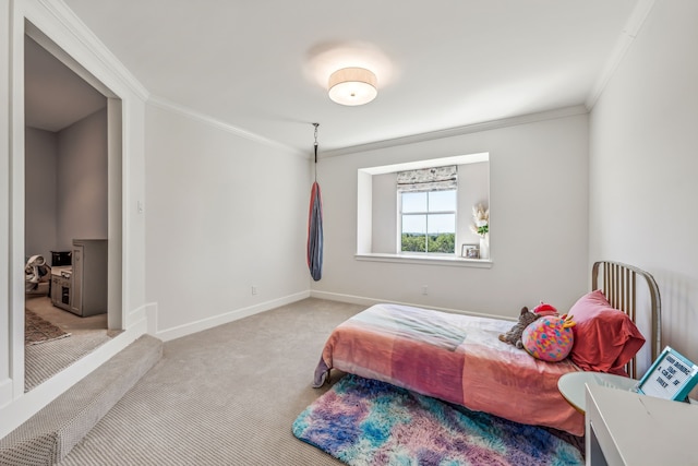 carpeted bedroom featuring crown molding