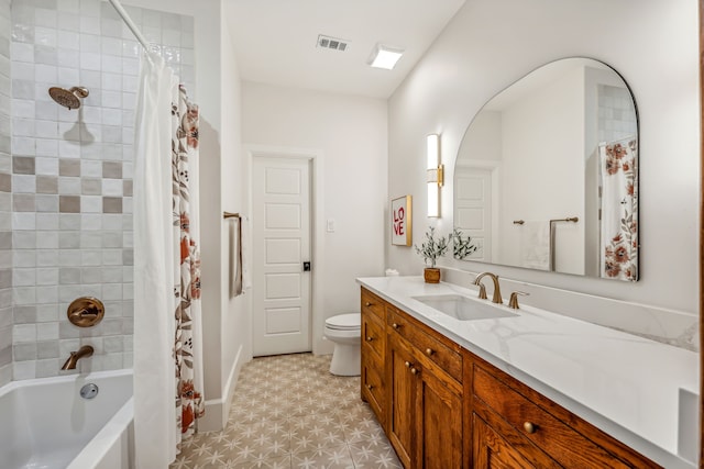 full bathroom featuring vanity, toilet, and shower / tub combo with curtain