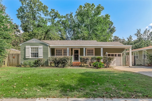 single story home featuring a front lawn, a garage, and covered porch