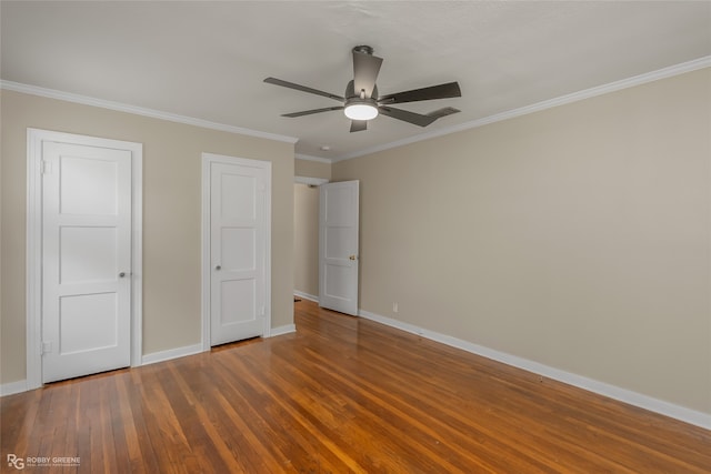 unfurnished bedroom featuring ceiling fan, crown molding, and wood-type flooring