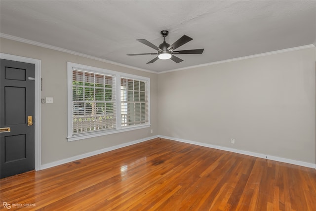 spare room with ornamental molding, hardwood / wood-style floors, and ceiling fan