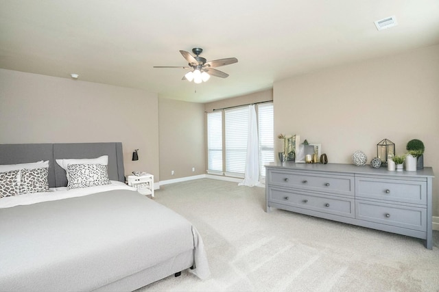 bedroom featuring ceiling fan and light colored carpet