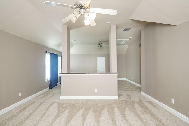 carpeted spare room with ceiling fan