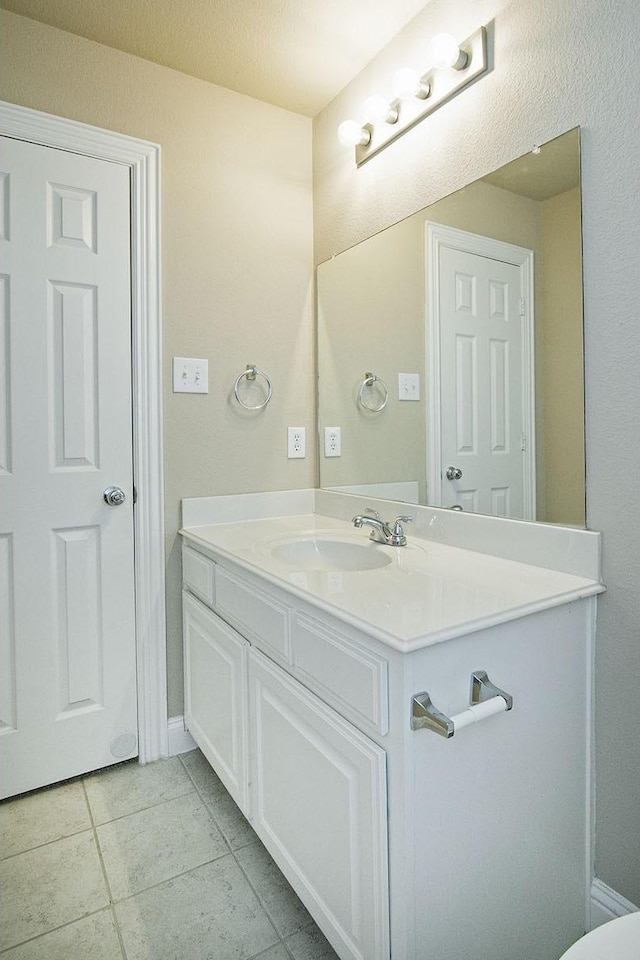 bathroom with vanity and tile patterned floors