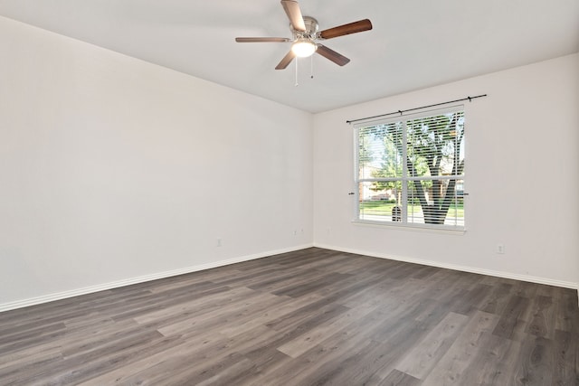 unfurnished room with dark wood-type flooring and ceiling fan